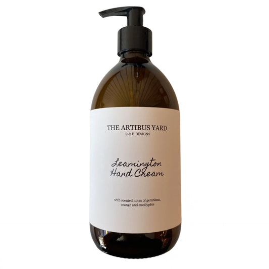 Leamington scented hand cream by The Artibus Yard, enriched with nourishing ingredients and fresh citrus and floral notes, packaged in an elegant amber glass bottle with pump dispenser.