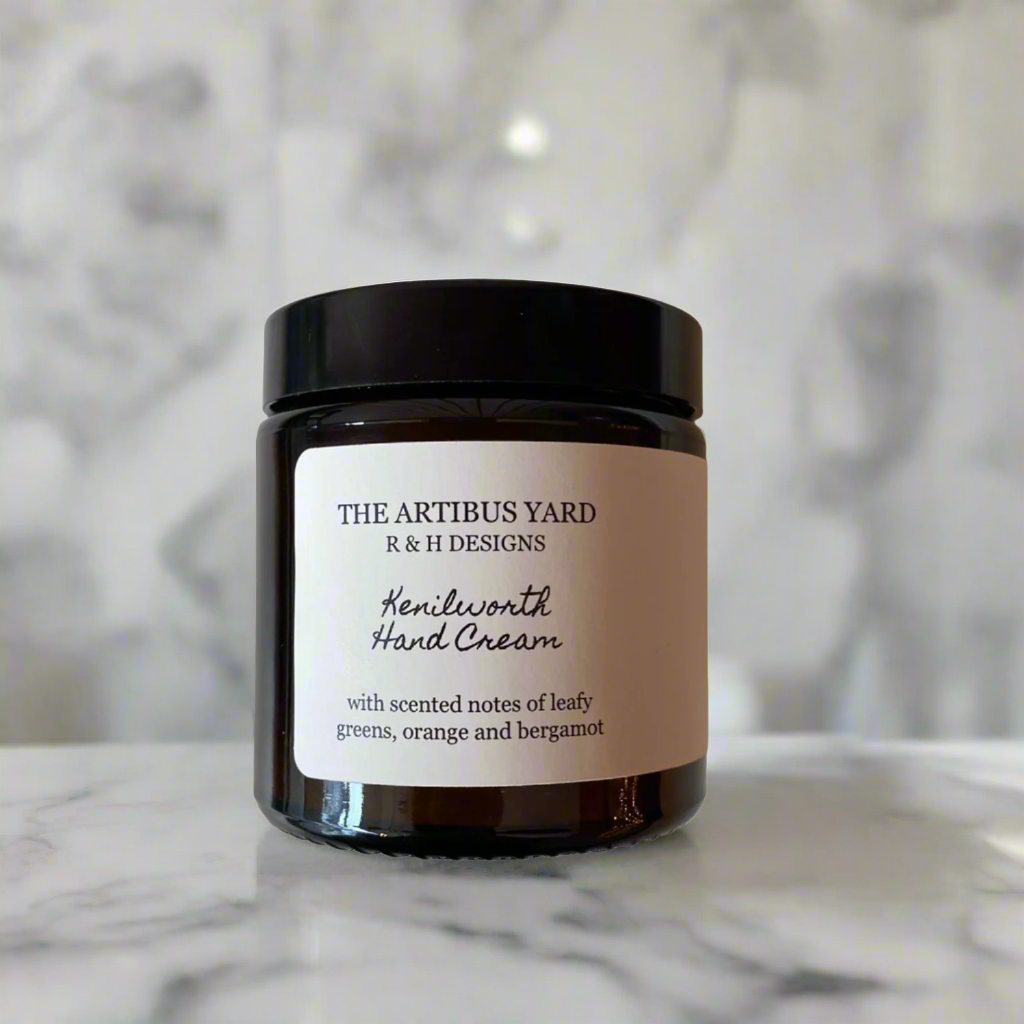 Kenilworth scented hand cream by The Artibus Yard, enriched with nourishing ingredients and leafy and citrus notes, packaged in an amber glass bottle