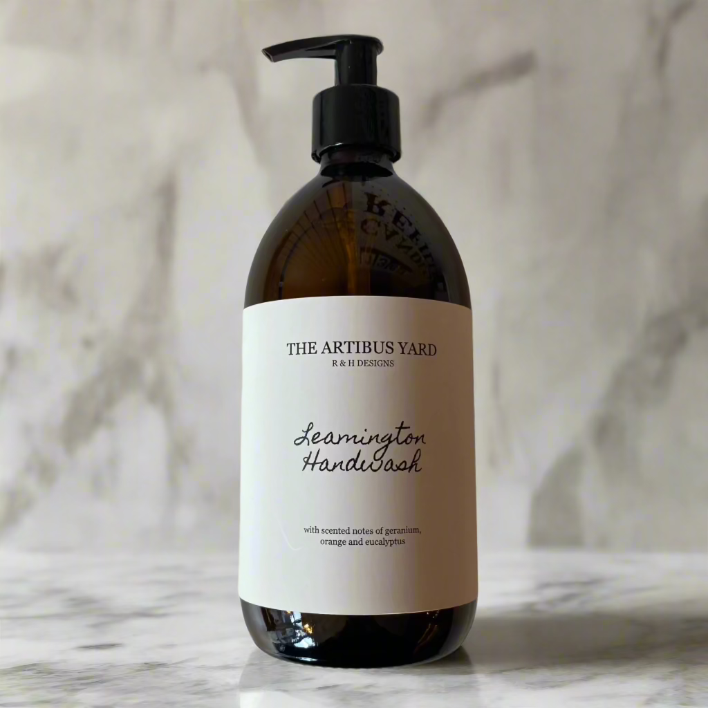 Leamington scented handwash by The Artibus Yard, crafted with gentle ingredients and fresh citrus and floral notes, in an amber glass bottle with pump dispenser.