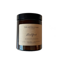 Hand-poured Stratford soy wax candle by The Artibus Yard, featuring notes of rose, pink pepper and musk; crafted in small batches in Warwickshire and poured into a reusable amber glass jar.