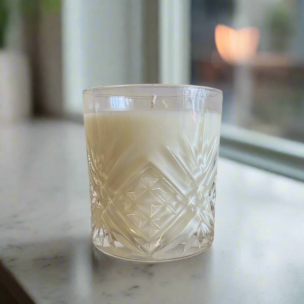 Whiskey Glass Candle by The Artibus Yard, infused with warm notes of oud, vetiver and musk